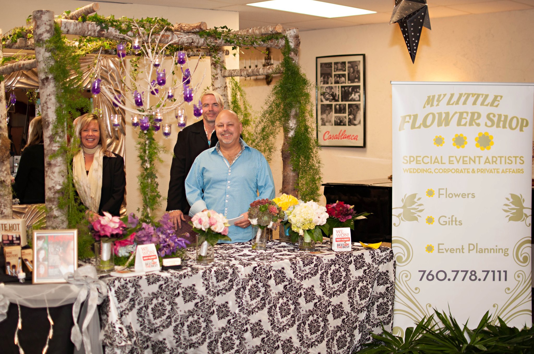 The My Little Flower Shop team shows off bouquets & centerpieces at a Bridal Show